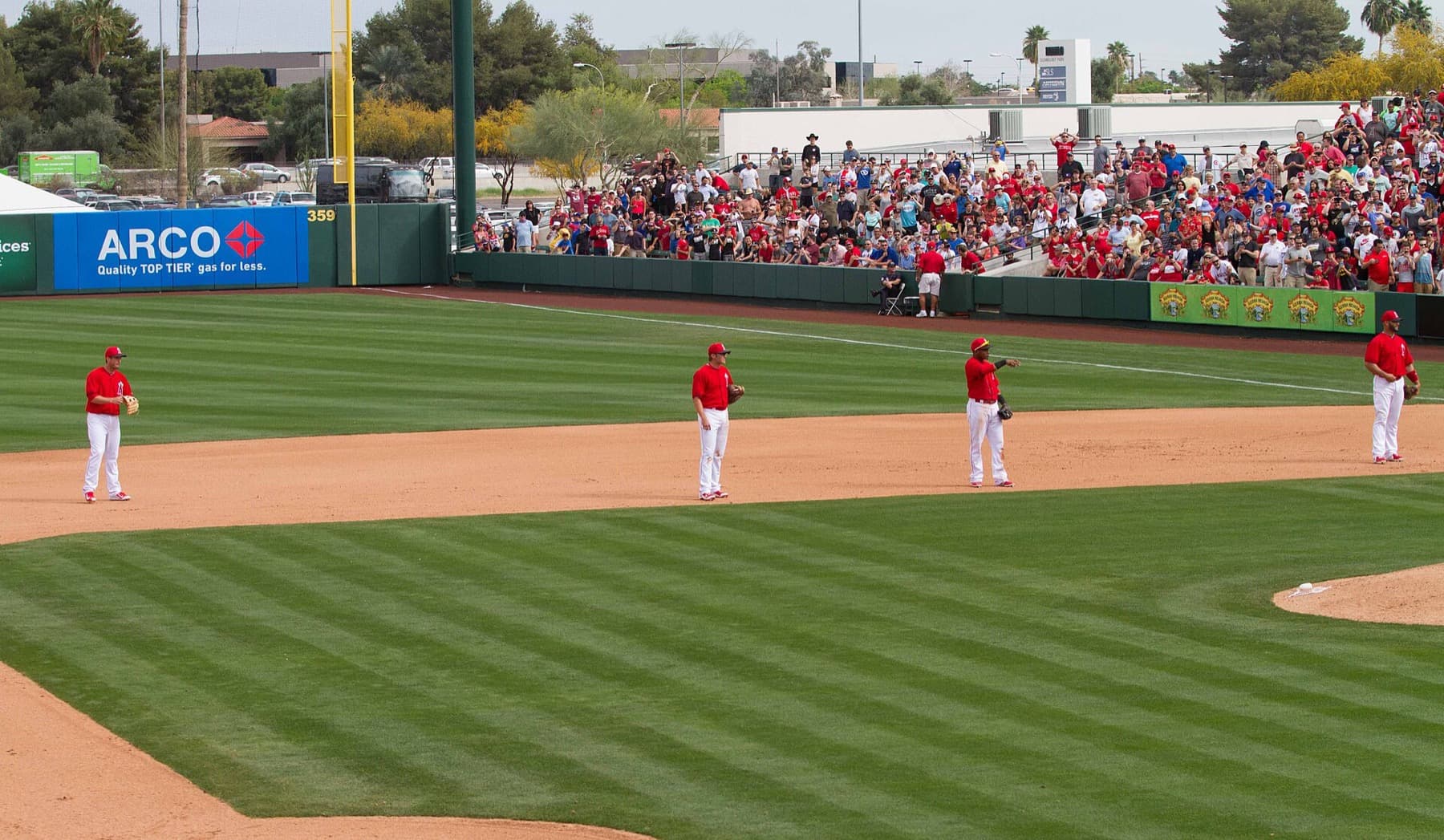 Los Angeles Angels infielders shifting against a pull hitter — the defensive alignment that rewrote batting averages before MLB restricted it.