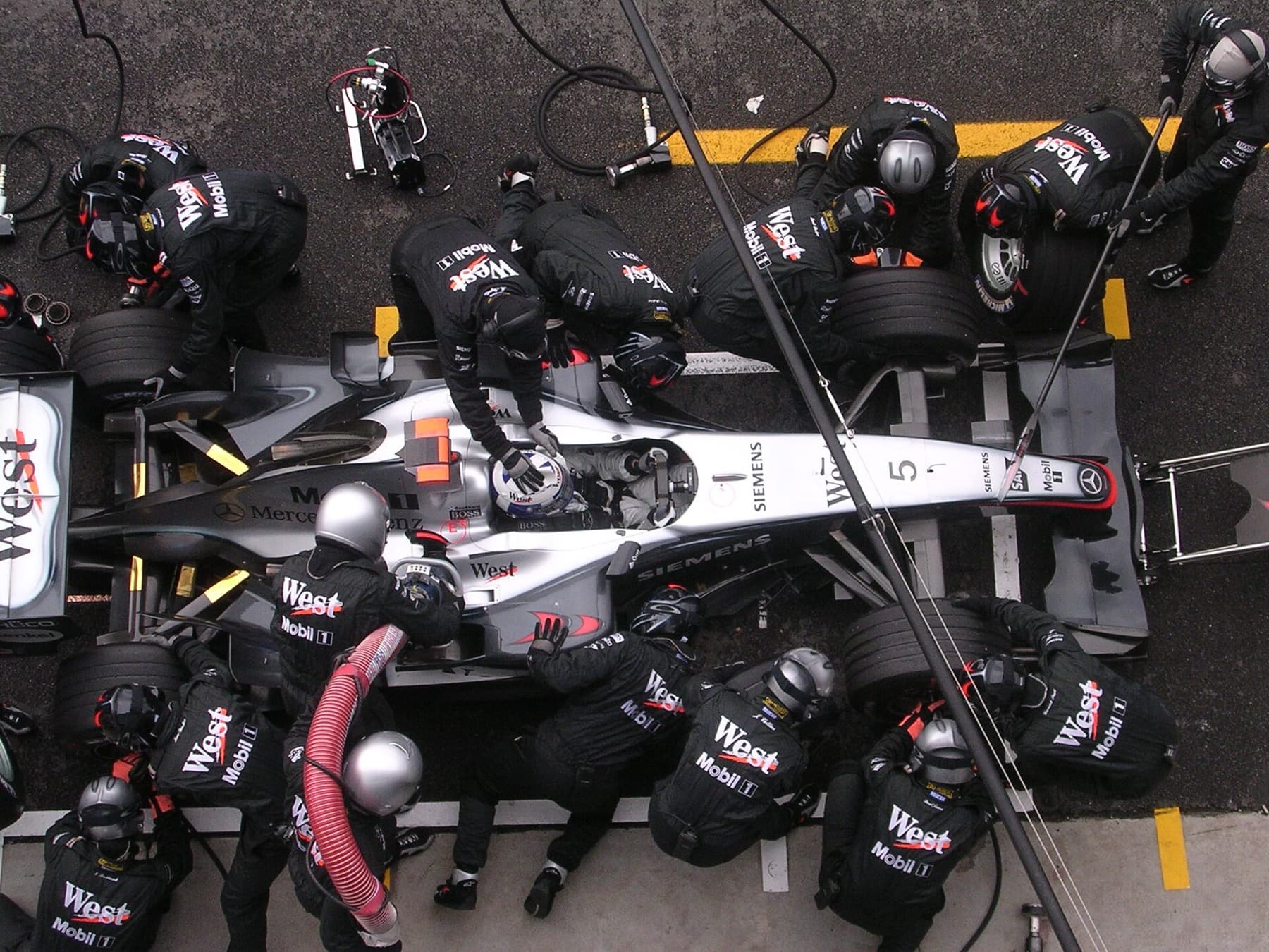 McLaren pit stop at Monza during the 2004 Italian Grand Prix — strategy decided races long before today’s compound windows.