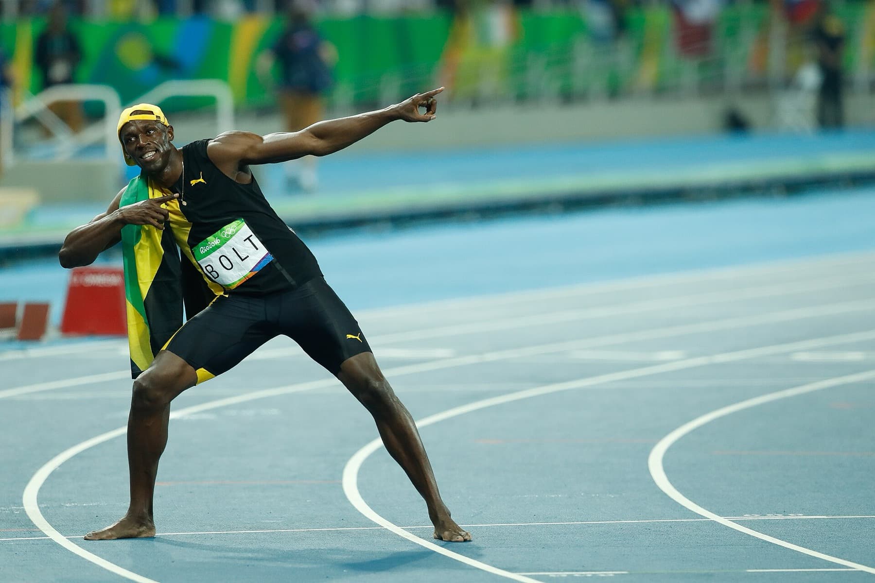 Usain Bolt winning the 100m final at Rio 2016 — a singular Olympic performance still used as a benchmark.