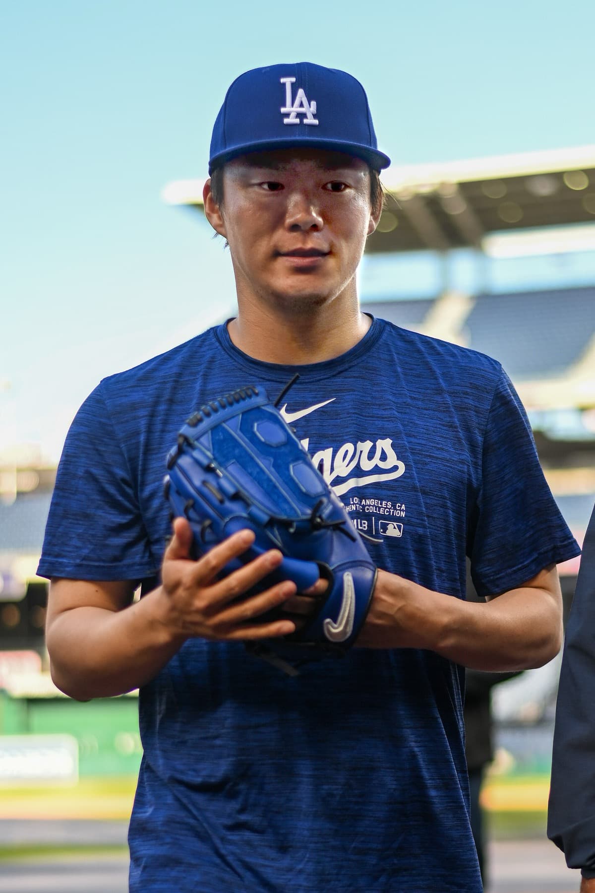 Yoshinobu Yamamoto in Dodgers kit in 2024 — the posting-system payday that reset the market for NPB aces.