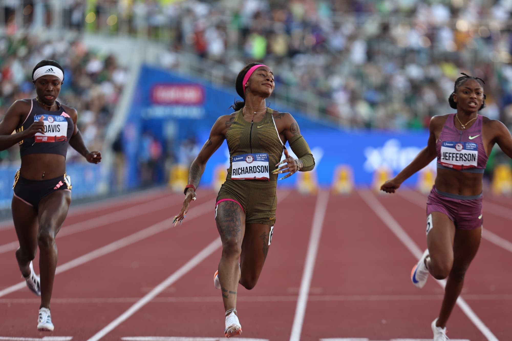 Sha’Carri Richardson, center, races Tamari Davis and Melissa Jefferson at the 2024 U.S. Olympic Team Trials — a national selection event layered over international qualification standards.