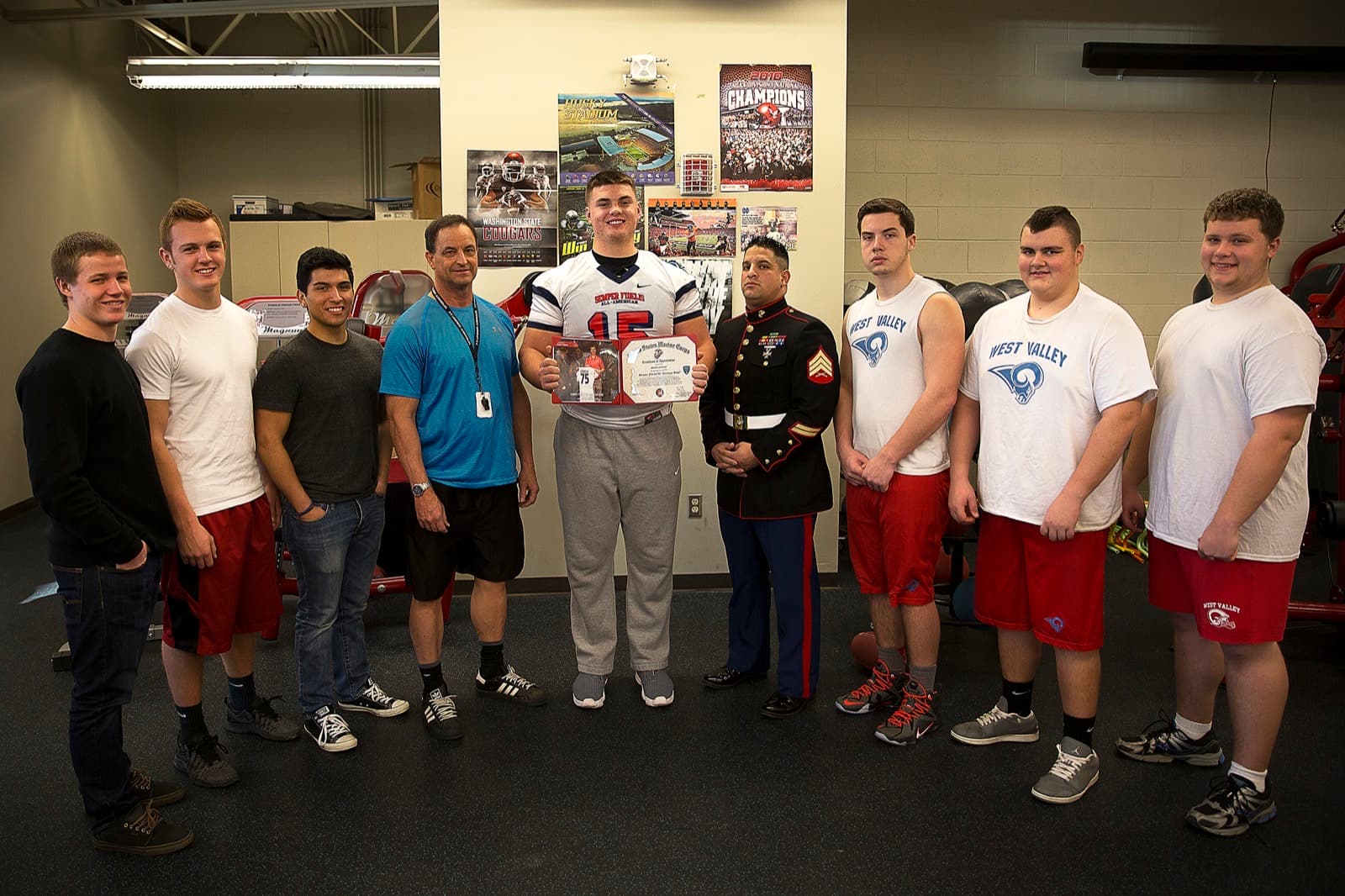 Oregon football commit Shane Lemieux, center, with West Valley High School teammates in Yakima in October 2014 — the scholarship path most families are trying to decode.
