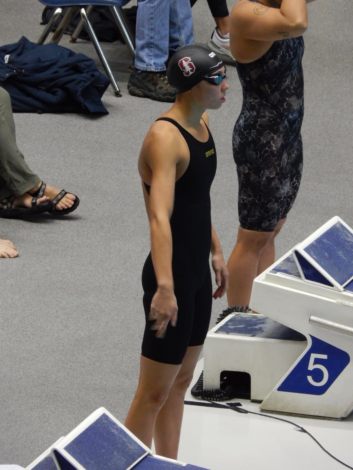 Torri Huske behind the blocks in the 100 yard butterfly prelims at the 2023 Pac-12 Championships in Federal Way, Washington.