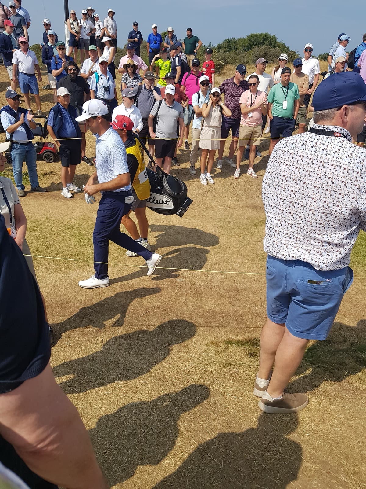 Jackson Suber walks a gallery corridor at Royal Birkdale during the second round of the 2026 Open Championship. Apple has held preliminary talks with the R&A about bidding for the tournament’s next U.S. media cycle after NBC’s deal ends in 2028.