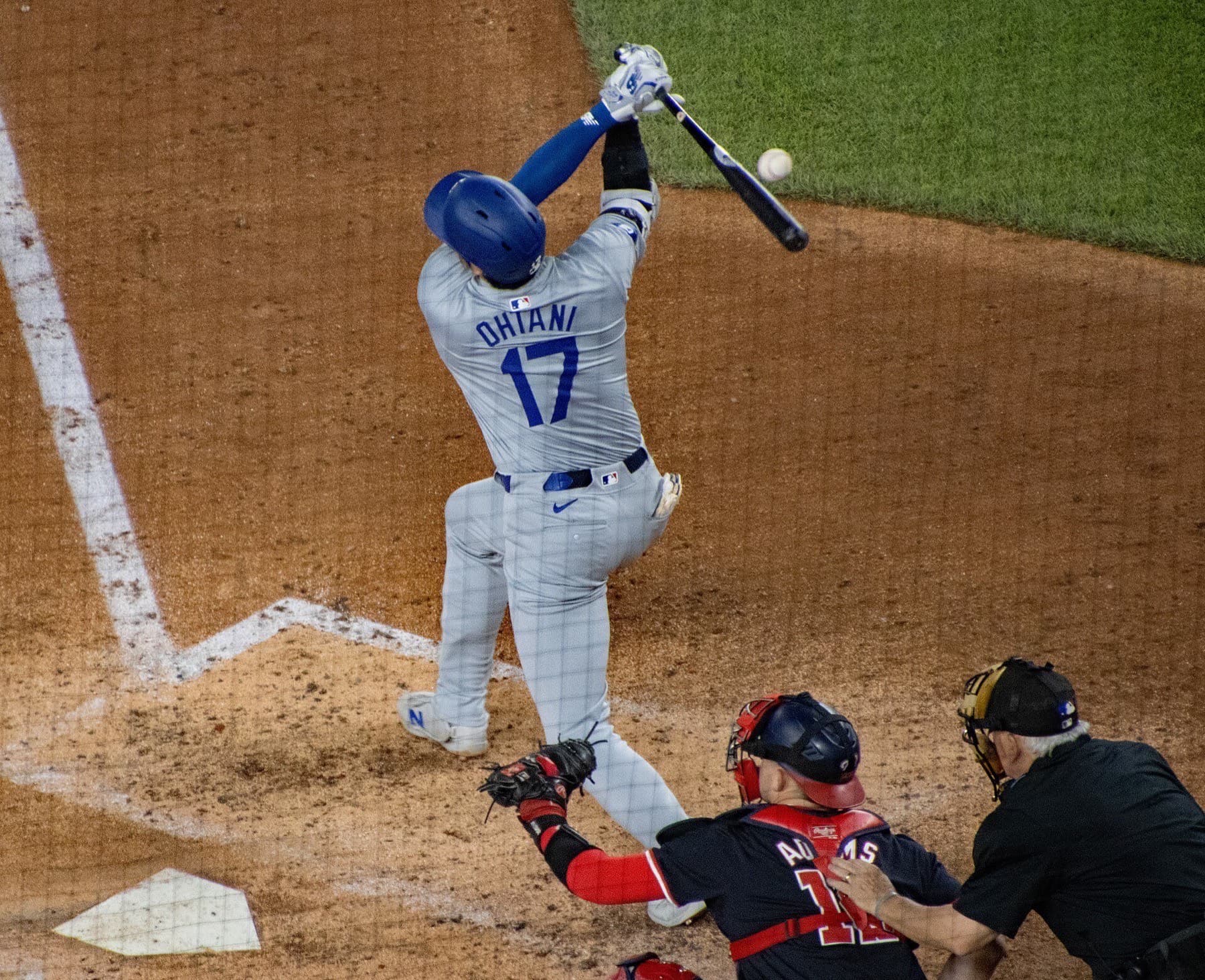 Shohei Ohtani swings for the Dodgers at Nationals Park in April 2024. The club is keeping him in the batting order while indefinitely pausing his pitching starts.